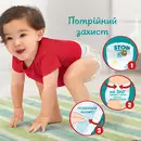 Подгузники-трусики для детей Памперс Пантс (Pampers Pants) размер 4 (9-15 кг) 52 шт — Фото 11